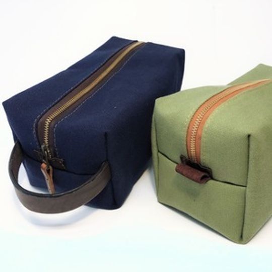 Toiletry Bag - canvas and leather with a 600D waterproof lining.